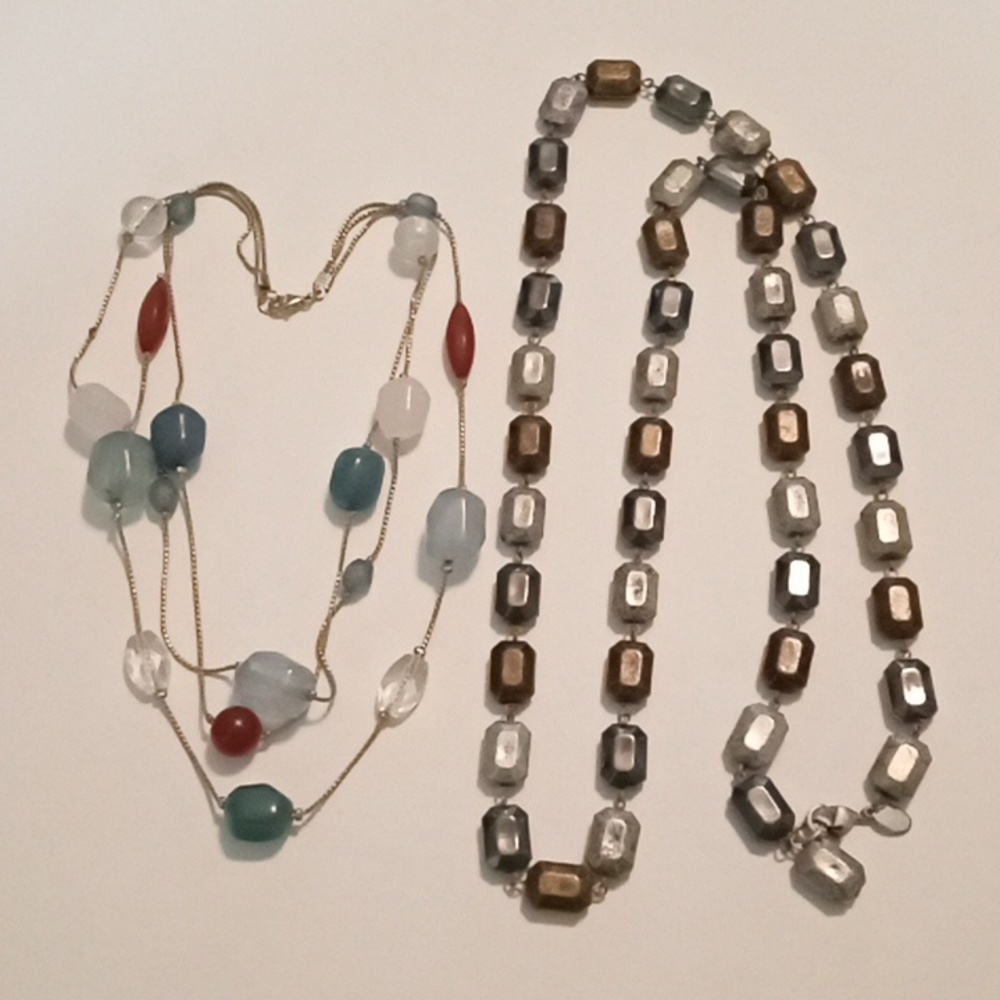 #1112.  2 Piece Assorted Blue And Silver Toned Acrylic Necklace Bundle.